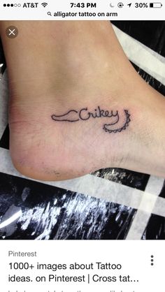 a small ankle tattoo with the word cheeky on it