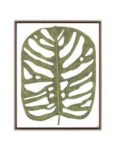 a green leaf in a wooden frame