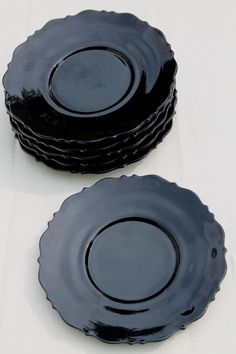 three black plates stacked on top of each other