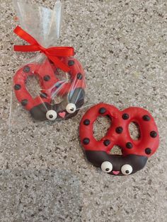 two decorated donuts in the shape of ladybugs