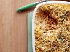 a casserole dish with macaroni and cheese in it on a table