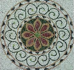 a circular design made out of beads