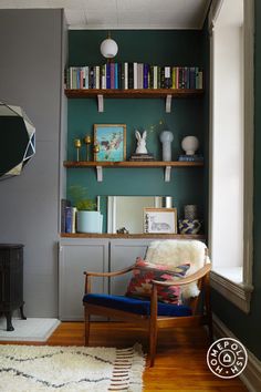 a living room filled with furniture and bookshelves