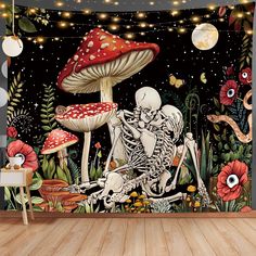 a room with a large wall mural featuring skeletons and mushrooms