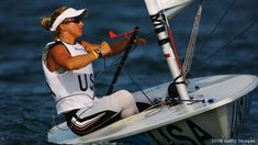 a woman on a sailboat in the water