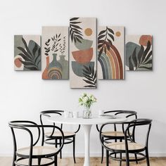 a dining room table with four chairs around it