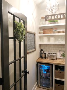 a kitchen with an open refrigerator next to it