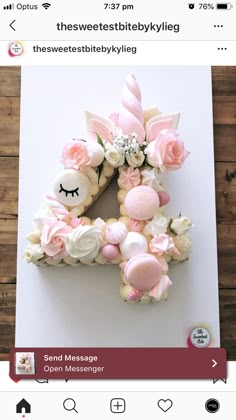 the letter e is made out of cupcakes and pink icing with flowers