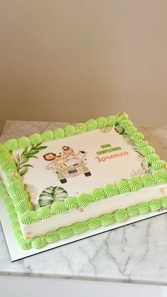 a green and white cake sitting on top of a counter