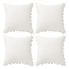 four white pillows with scalloped edges are arranged on a white background, each one is