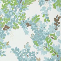 a blue and green floral wallpaper with lots of leaves on the bottom half of it