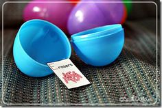 two blue bowls sitting next to each other on top of a couch with balloons in the background