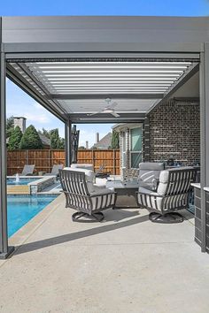 an outdoor living area next to a swimming pool