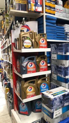 the shelves are filled with different types of cleaning products