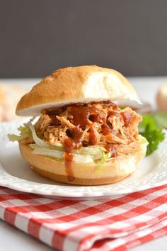 healthy crockpot bbq chicken sandwich on a plate