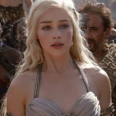 a woman with blonde hair and blue eyes wearing a silver dress in the movie game of thrones