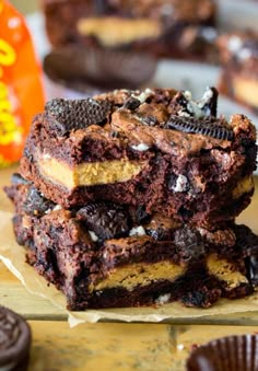 a stack of cookies and oreo brownies sitting on top of each other