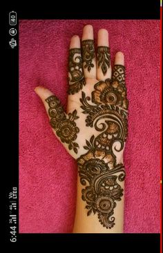 henna tattoo on the palm of someone's hand