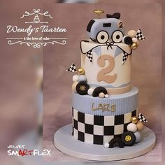 a three tiered cake decorated with an image of a cartoon character on the top