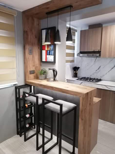 a kitchen with an island and bar stools