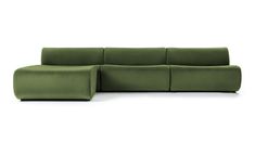 a green couch sitting on top of a white floor