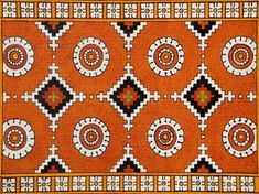 an orange and black area rug with circles on it