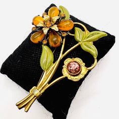 Beautiful Tall Art Deco Amber Lucite Enameled Rhinestone Flower Brooch. Gold tone metal in the form of a flower set with amber lucite petals,art glass and rhinestones and green enameled leaves. In excellent vintage condition with minimal age appropriate wear. Measures 3 3/8 inches tall by 2 3/8 inches wide. Old style c-clasp secure. Tall Art, Jewelry Board, Jewelry Boards, Rhinestone Flower, Vintage Antique Jewelry, Brooch Vintage, Enamel Flower, Vintage Costume Jewelry, Flower Brooch