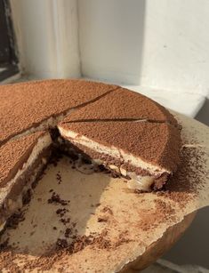 a chocolate cake with one slice missing from it