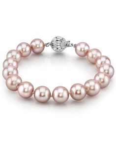 This bracelet consists of 10-11mm AAA quality freshwater pearls with 'Very High' luster, our highest grade available. 

The brilliant pink color of this bracelet would also go great with one of our exquisite lavender freshwater necklaces. 

The pearl bracelet is affixed with a beautiful 14K white or yellow gold clasp of your choice. Leather Pearl Jewelry, Single Pearl Necklace, Pearl Bracelets, Mother Of Pearl Jewelry, Pearl Jewelry Wedding, Lavender Pink, Buy Earrings, Freshwater Pearl Bracelet, Pearl Choker Necklace