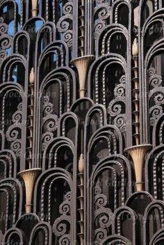 an intricately designed building is shown against the blue sky