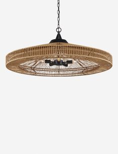 a bamboo chandelier hanging from the ceiling with two birds perched on top of it