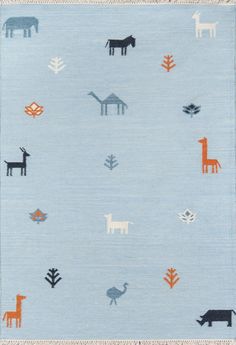 a blue rug with animals and trees on it