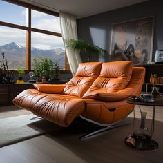 an orange leather reclining chair sitting in front of a large window with mountains outside