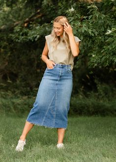 Let us introduce you to the denim skirt you'll want to wear with everything, the Lee A-Line Raw Hem Midi Skirt! This stunning midi denim skirt is an Inherit Design made in the USA! Crafted from high quality, stretchy, medium wash denim that is super soft and will keep you comfortable all day long. The A-line fit is walkable, modest, and on-trend with a raw hem. This sustainable, modest, American-crafted skirt is a true seasonless staple you will wear for years to come! Style | Midi, Denim Color Straight Leg Skirt With Frayed Hem For Fall, Spring High-rise Dark Wash Denim Skirt, Casual Medium Wash Denim Midi Skirt, Relaxed Fit Denim Skirt For Fall, Relaxed Denim Skirt For Fall, Denim Relaxed Fit Skirt For Fall, Fall Denim Lined Skirt, Casual Medium Wash Midi Skirt, Fall Denim Skirt With Lined Detail