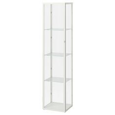 a tall white glass display case with three shelves