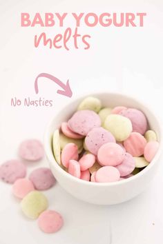 pink and yellow hearts in a white bowl next to the words sweet sweets on it