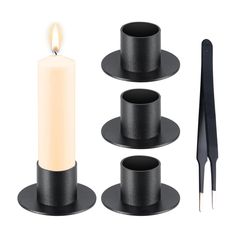 the candle holder is made from black plastic and has three candles on each side, one with