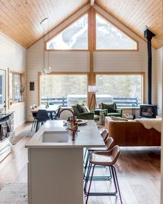 a kitchen and living room are shown in this house's open floorplan