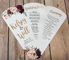 three wedding program fans with flowers on them