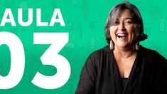 a woman smiling and standing in front of a green background with the number thirty three