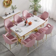 a dining table with pink chairs around it