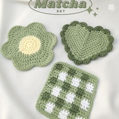 four crocheted clover coasters are shown in green and white, with the words matcha written on them