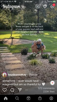 an old man kneeling down in the middle of a garden with his hands on his knees