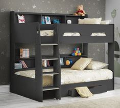 a black bunk bed with stairs and bookshelves in a child's bedroom