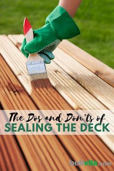 a person in green gloves painting a wooden deck with text overlay that reads, the dos and don'ts of sealing the deck