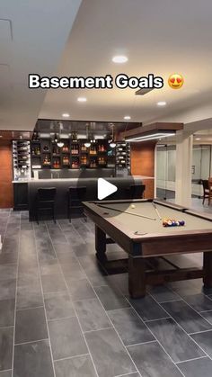 this is an image of a basement game room with pool table and foosball