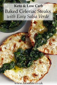 two pieces of bread with spinach and cheese on top, next to a bowl of sauce