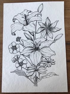 a drawing of flowers is shown on a piece of paper