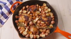 roasted chicken and potatoes with rosemary garnish