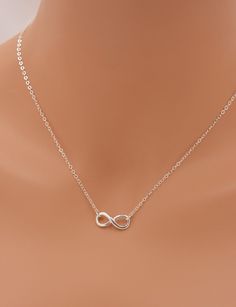 MADE WITH ALL SOLID STERLING SILVER PARTS - A GREAT KEEPSAKE This beautiful piece is made using solid sterling silver for a quality necklace. I use a sterling silver infinity charm set on a sterling silver chain. The necklace closes with a spring clasp. The infinity charm is the perfect size for a refined look. Comes in a gift box, perfect for gift-giving. **SIZING - PLEASE READ: Select your necklace size at checkout. Note that necklaces will fit differently depending on a person's size. Please Silver Infinity Clavicle Chain Jewelry, Sterling Silver Infinity Necklace With Adjustable Chain, Silver Infinity Clavicle Chain Necklace, Silver Infinity Jewelry, Hypoallergenic Sterling Silver Infinity Jewelry, Hypoallergenic Infinity Sterling Silver Jewelry, Silver Infinity Necklace In Dainty Style, Silver Infinity Dainty Necklace, Silver Dainty Infinity Necklace